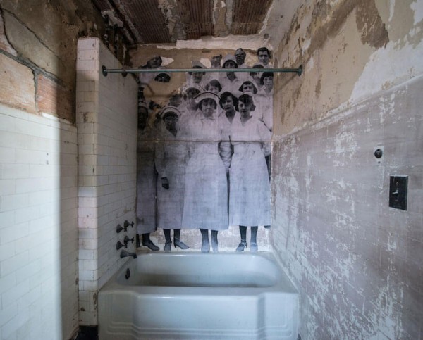 UNFRAMED Photo Exhibition in the abandoned Ellis Island Hospital by street artist JR 11