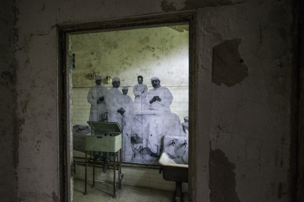 UNFRAMED Photo Exhibition in the abandoned Ellis Island Hospital by street artist JR 15