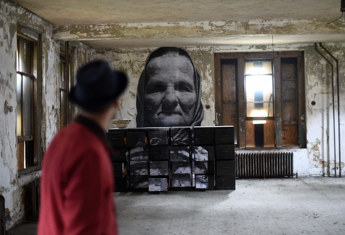 UNFRAMED Photo Exhibition in the abandoned Ellis Island Hospital by street artist JR 24